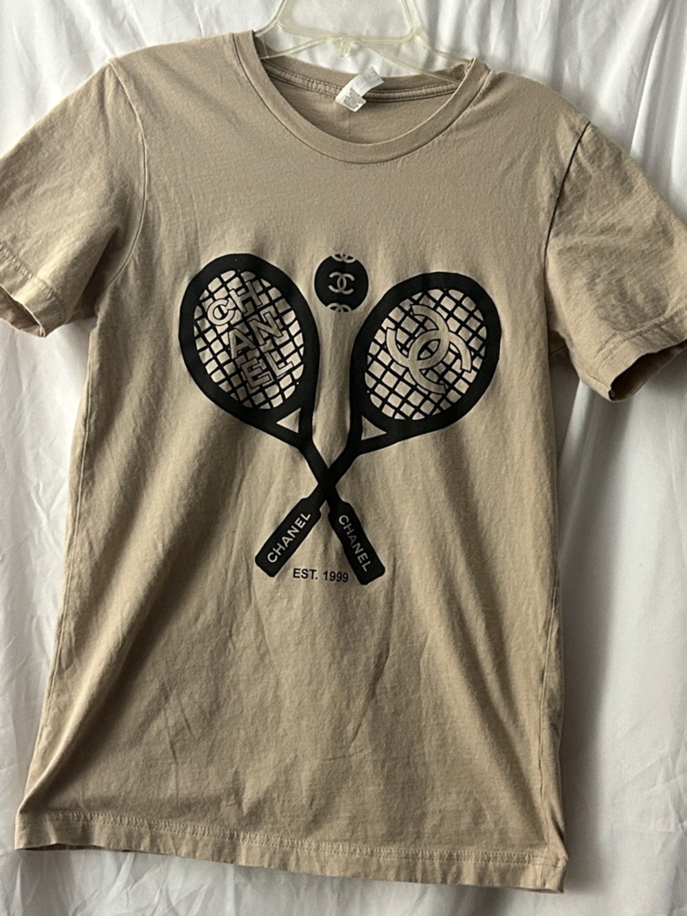 Bella Canvas Beige Short Sleeve Tee with Black Tennis Racket Graphic